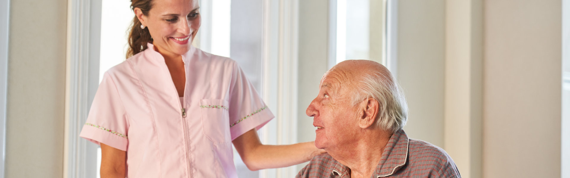 caregiver woman accompanying a senior man