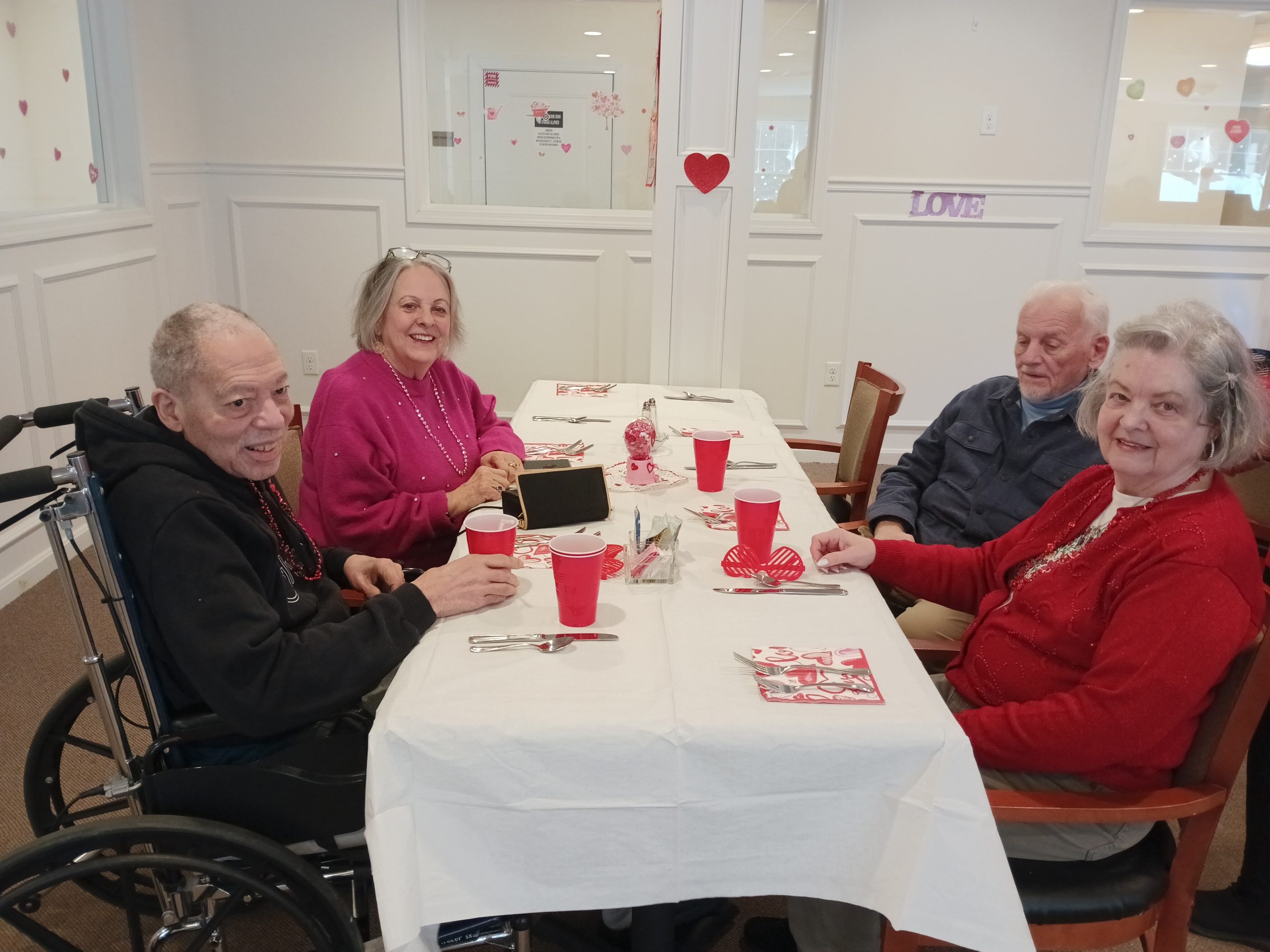 Table with food and people sitting