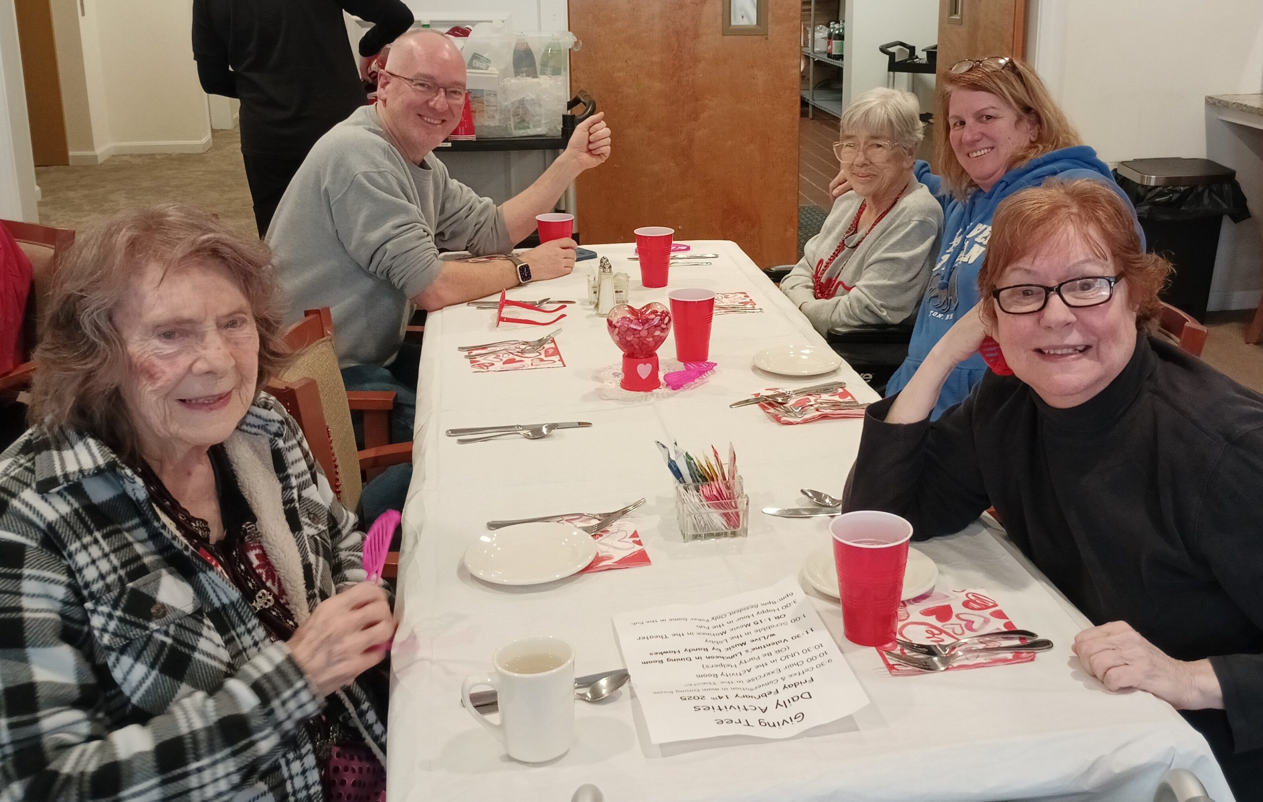 Table with food and people sitting