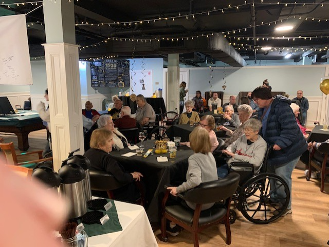 event hall with elderly people dining